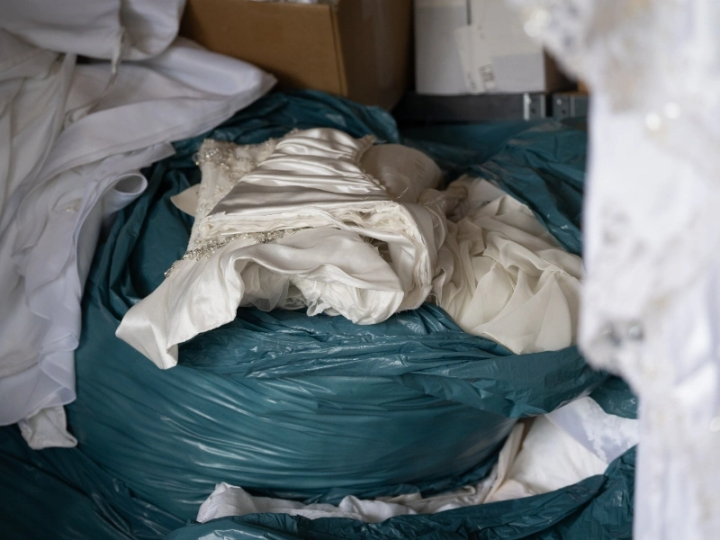 Collected wedding dresses ready for transformation at La Femme Qui Rit | Waste Alchemists