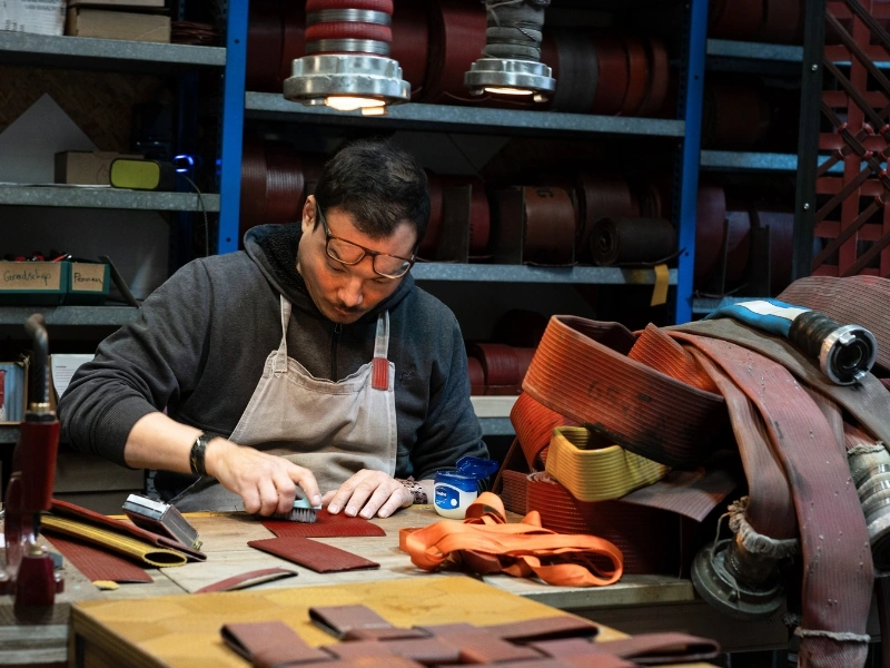 Eversom cutting, cleaning and preparing fire hoses for new use | Waste Alchemists