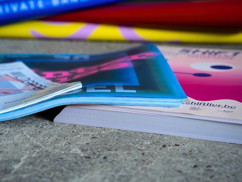 Stack of discarded posters, cultural banners and leftover print sheets collected for upcycling by Redopapers | Waste Alchemists