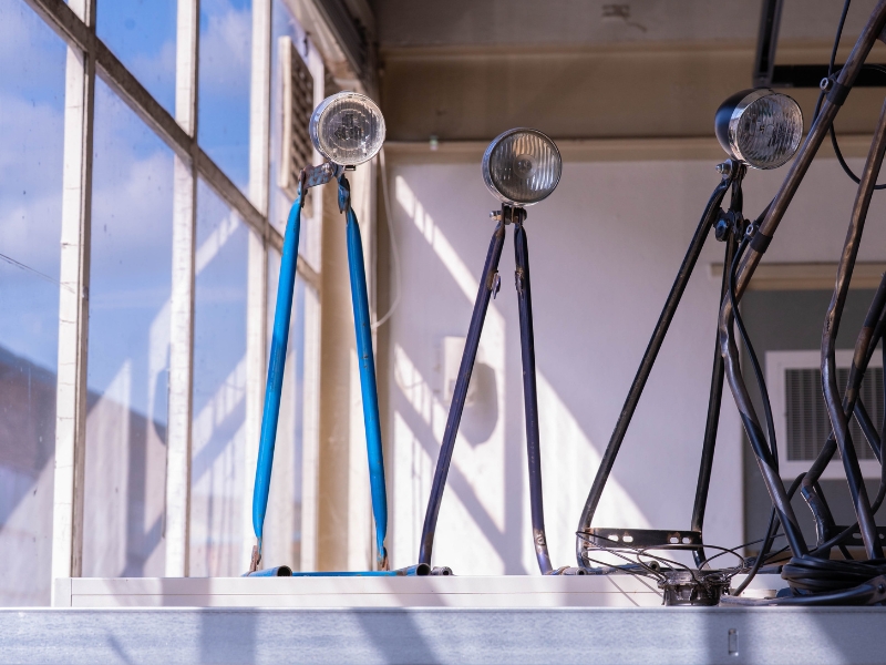 Broken bicycle parts before upcycling and the finished Roestug bike and accessories after | Waste Alchemists