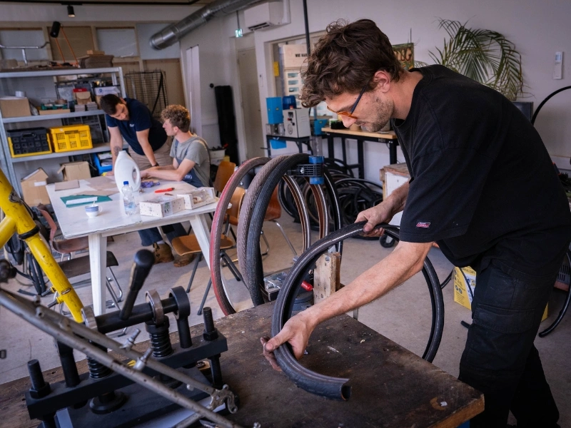 Roestug team dismantling a bike and selecting usable parts for circular rebuilding | Waste Alchemists