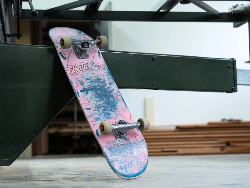 Stack of broken and discarded skateboard decks collected by Skateriors | Waste Alchemists