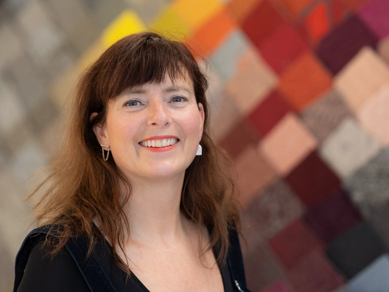 Portrait of Tynke van den Heuvel working on circular flooring and tile design | Waste Alchemists