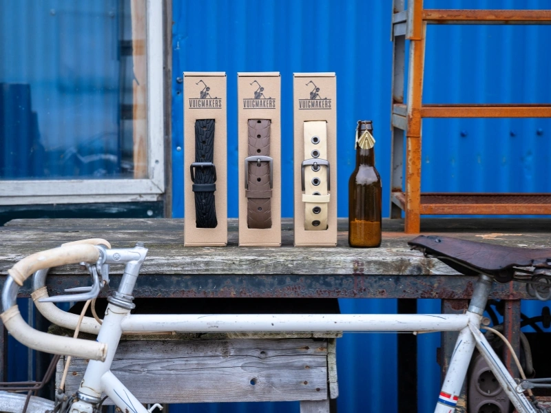 Belts made from bicycle tires and earrings made from bottle caps by Vuigmakers | Waste Alchemists