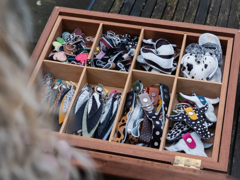Box of accessories made from leather and cow skin scraps by Mooza | Waste Alchemists